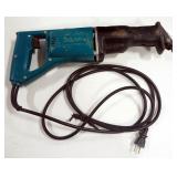 Makita Reciprocating Saw Model JR3000V, With Extra Blades And Manual, In Metal Case, Powers On