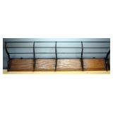 Wall Hanging Rack With Cast Iron Hooks And Rods To Hold Items On Top