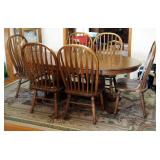 Oval Solid Oak Double Pedestal Dining Table, 30" x 68" x 42", With 2 18" Leaves And Matching Chairs 