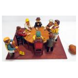 Reverse Marionette Of People Playing Poker, Arms Raise Up And Down As Barell Swings Below