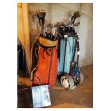 Vintage His And Hers Golf Clubs Including Wilson And Dunlop Clubs, Rolling Golf Bag Carts, & Golf Cl