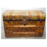 Antique Rounded Top Trunk With Tin Overlay, Caster Wheels, Wood Bumpers And Inner Tray, 23.25" High 