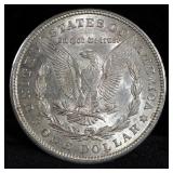 1884 And 1921 Morgan Silver Dollars