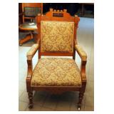 Antique Upholstered Eastlake Arm Chair On Porcelain Casters, 39" x 26" x 22"