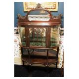 Antique Walnut Curved Glass Curio Cabinet with Mirrored Back, Lion Head Crown, Cabriole Legs, And Ke