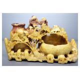 Soapstone Carving Of Sunflowers And Pottery