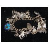 Sterling Silver Bracelet With Numerous Charms, Many Sterling, Approx 70.7 g Total Weight