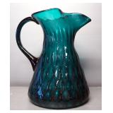 Colored Glass Pitcher With Artistic Pattern In Glass