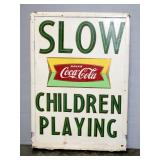Coca-Cola Slow Children Playing Double-Sided Metal Sign, 29" High x 21" Wide