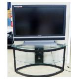 Sylvania 42" LCD Color TV Model LC420SS8, Powers On, And Glass Shelf TV Stand