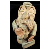 Ceramic Figurine Of Man And Decorative Stone Scroll