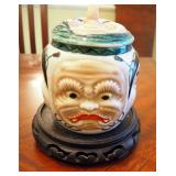 Hand Painted Banko Ware Five Face Jar With Lid On Carved Wood Stand, 6.5" Tall