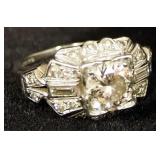 Diamond Ring With 1 Center Diamond (1.10 CT), 2 Baguettes (.10 CT TW), And 20 Melee Diamonds (.40 CT