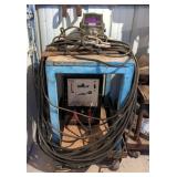 Miller Thunderbolt 225V AC Shielded Metal Arc Welder, Model HD-1, With Cables And Hood, On Metal Rol