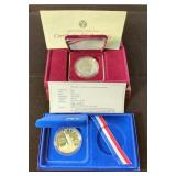 1986 Liberty Silver Dollar And 1988 US Olympic Silver Dollar With COA, Both 90% Silver, Both In Disp