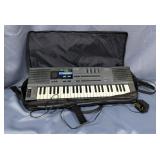 Casio HT-700 Electric Keyboard With Carry Case And Power Cord, Powers On