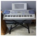 Casio CTK-593 Electronic Keyboard Musical System With Adjustable Metal Stand, Powers On