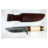 The Bone Collector Damascus Fixed Blade Knife, 6.25" Blade, In Tooled Leather Sheath  The Bone Collector Damascus Fixed Blade Knife, 6.25" Blade, In Tooled Leather Sheath