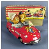 Vintage Kissing Couple Battery Operated Tin Litho Toy Car 