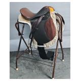 English Dressage Saddle, new stirrup leathers, a 42" girth, and a saddle pad English Dressage Saddle, new stirrup leathers, a 42" girth, and a saddle pad