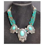 Turquoise Colored Bead Necklace With Silver Colored Elements