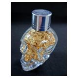 24K Yellow Gold Flakes In Skull Shaped Glass Bottle