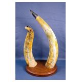 Carved Horns With Eagle Head Tips And Engraved Feather Design, Mounted On Wood 
