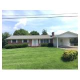 ABSOLUTE REAL ESTATE AUCTION BRICK HOME IN THE HEART OF POWELL