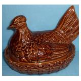 rockingham style hen on nest