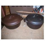 2 cast iron Dutch ovens