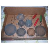 box of  various size strainers