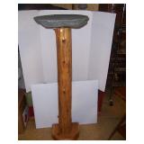 unusual pedestal with fieldstone top