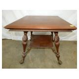 LG WALNUT GRIFFIN HEADS CENTER TABLE 