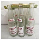 EARLY CARRIER W/ FOSTERS BOTTLES
