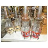 VARIOUS MODERN OIL BOTTLES/RACKS 