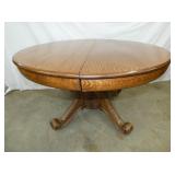48IN OAK TABLE W/ CARVED BASE