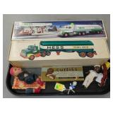HESS TRUCKS W/ BOXES, DOLLS, ETC