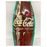 CLOSEUP CONVEX COKE BOTTLE