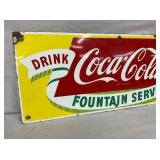 CLOSEUP LEFTSIDE COKE SIGN