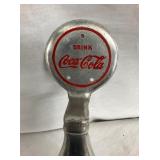 CLOSEUP COKE BOTTLE DOOR PULL