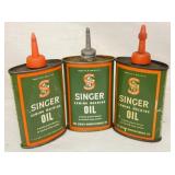 BACK VIEW SINGER OIL TINS