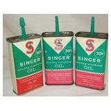 BACK VIEW SINGER OIL TINS