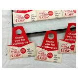 CLOSE UP VIEW COCA-COLA BOTTLE TOPPERS
