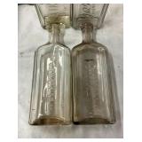 CLOSE UP VIEW EMB. WATKINS BOTTLES 