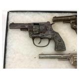 VIEW 2 CLOSEUP EARLY CAP PISTOLS
