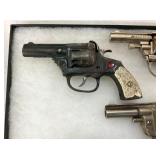 VIEW 2 CLOSEUP EARLY CAP PISTOLS