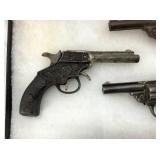 VIEW 2 CLOSEUP EARLY CAP PISTOLS