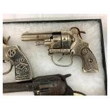 VIEW 2 CLOSEUP EARLY CAP PISTOLS