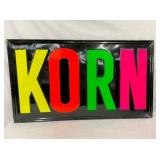 EMB. KORN METAL SIGN