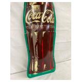CLOSEUP VIEW COKE BOTTLE SIGN